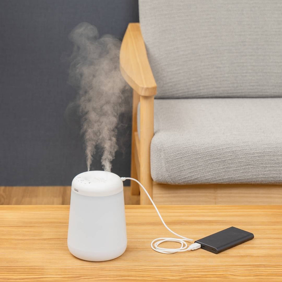 Cordless top-fill humidifier with dual mist function that prevents water spills even if it falls over