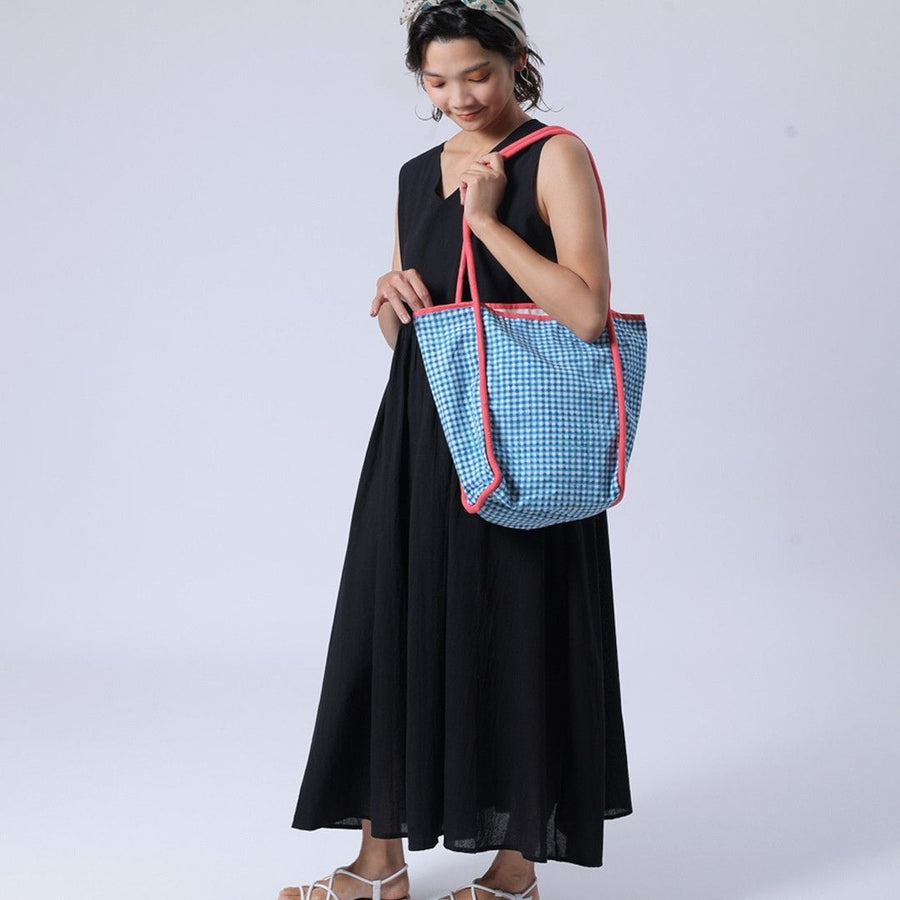 Block-printed gingham check bag with piping accents