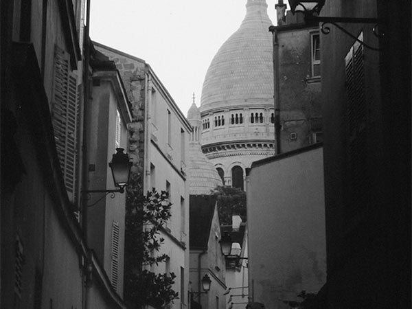 France / Paris Sacre Coeur Basilica at the end of a small street