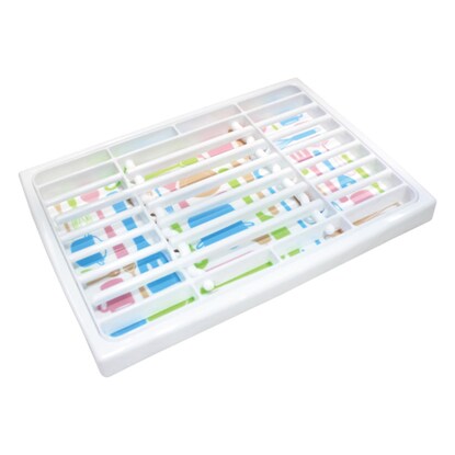 A baby bottle draining tray with removable slats for easy cleaning