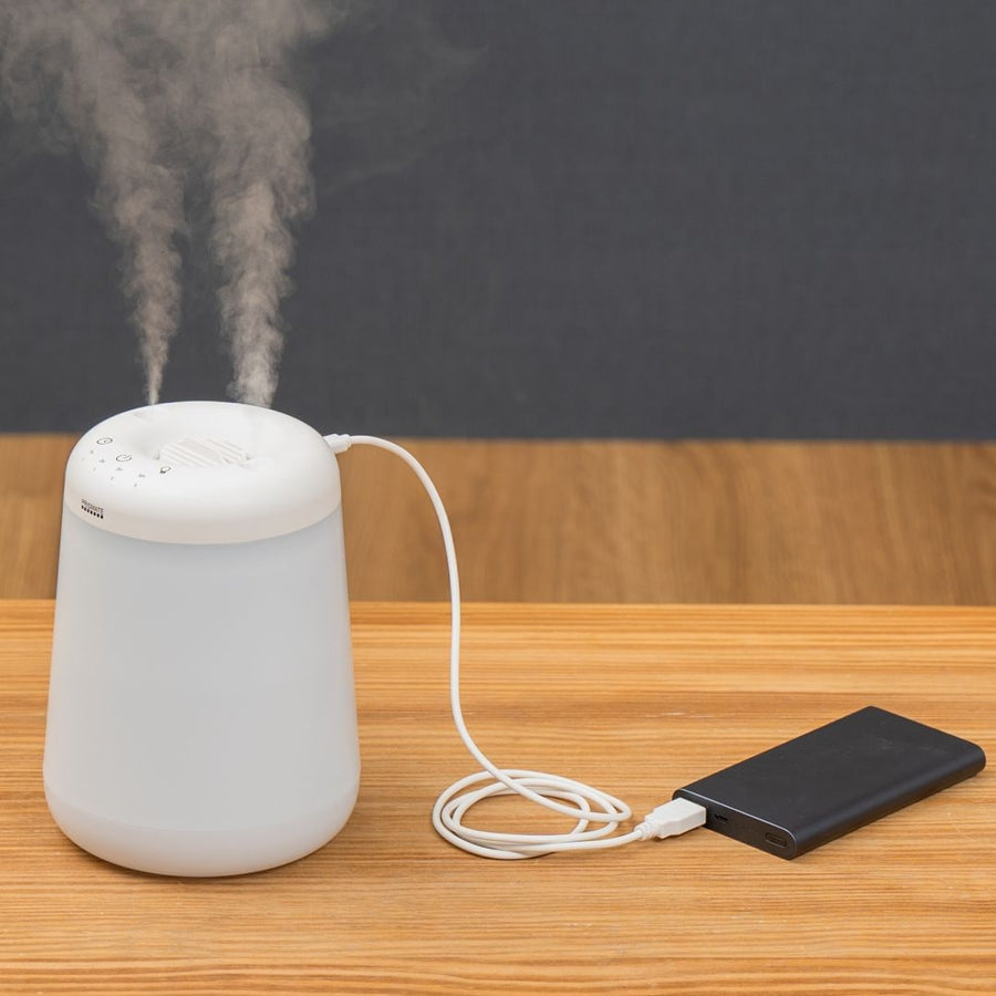 Cordless top-fill humidifier with dual mist function that prevents water from spilling even if it falls over.