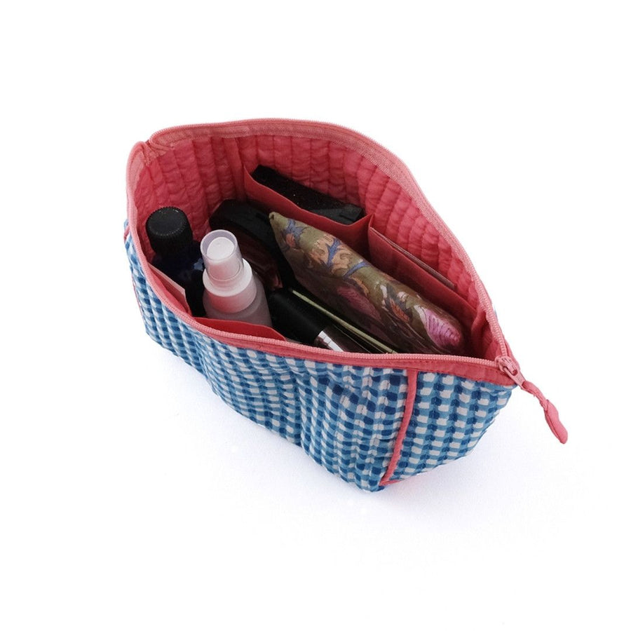 A block-printed gingham check pouch that makes it easy to see inside