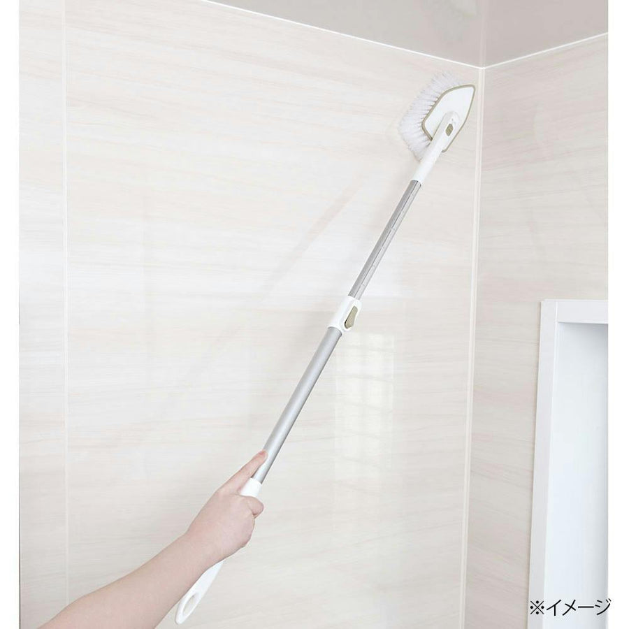 One-touch slide extendable bath brush