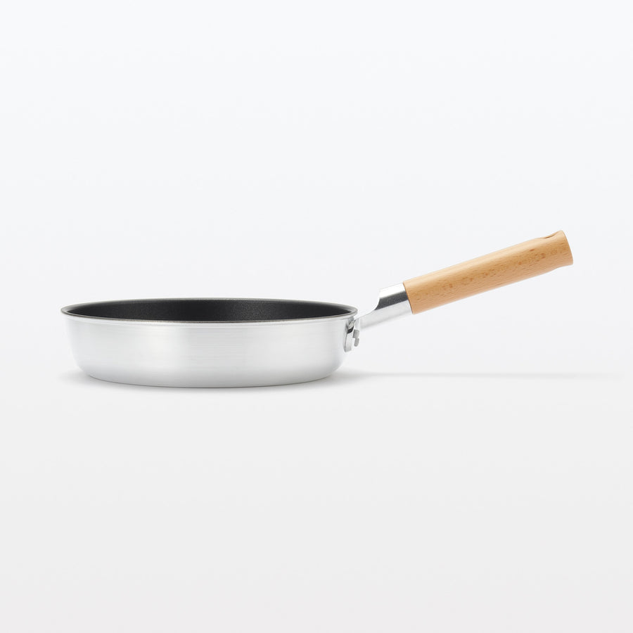 A shallow frying pan with a large cooking surface and low sticking properties