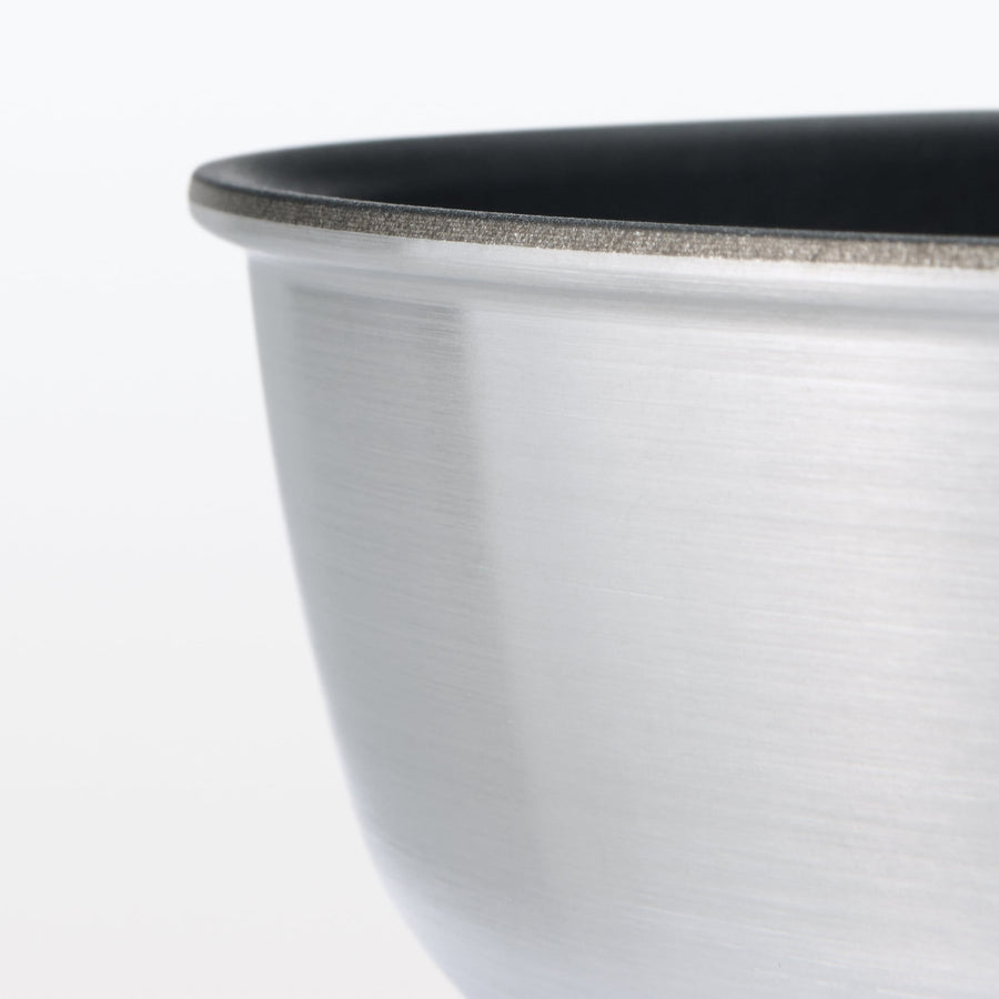 A shallow frying pan with a large cooking surface and low sticking properties