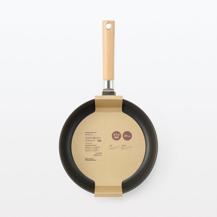 A shallow frying pan with a large cooking surface and low sticking properties