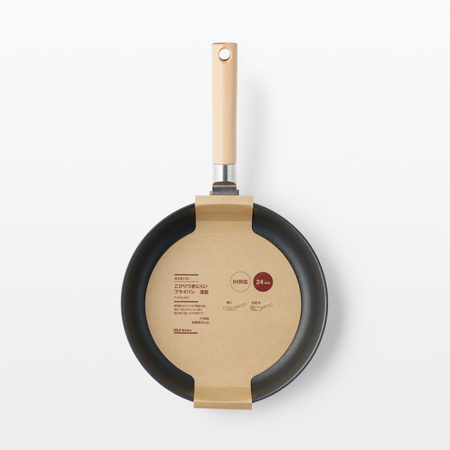 A shallow frying pan with a large cooking surface and low sticking properties