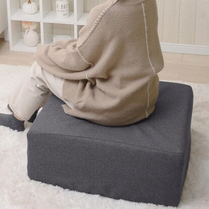 A sleeping mattress that can be used as an ottoman or stool (gray)