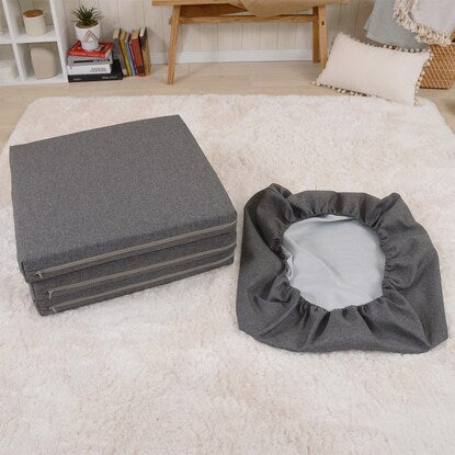 A sleeping mattress that can be used as an ottoman or stool (gray)