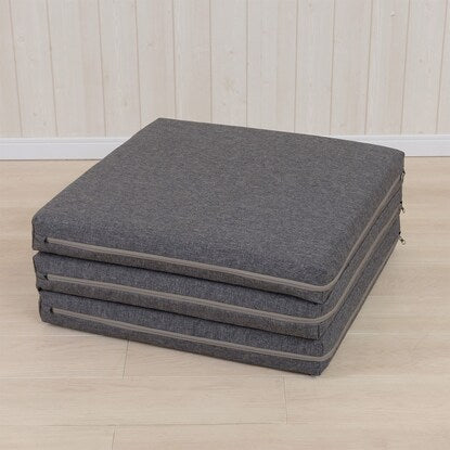 A sleeping mattress that can be used as an ottoman or stool (gray)