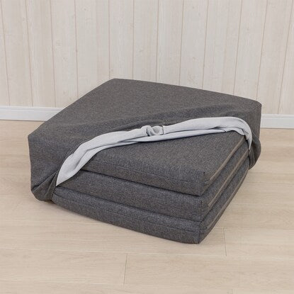 A sleeping mattress that can be used as an ottoman or stool (gray)