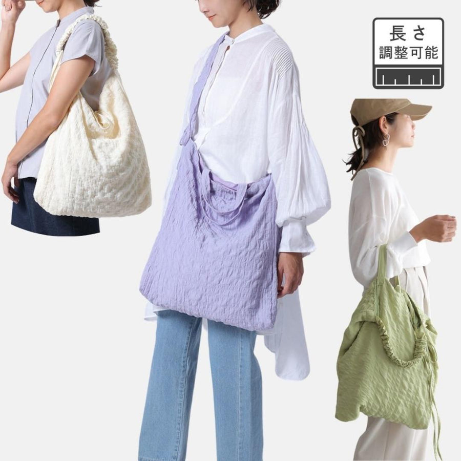 A crumpled drawstring gathered handle bag