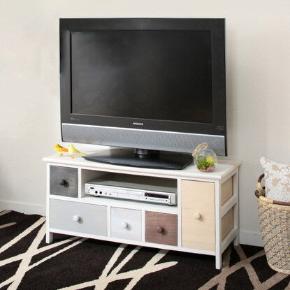 A pale, colorful, shabby TV stand (W84)