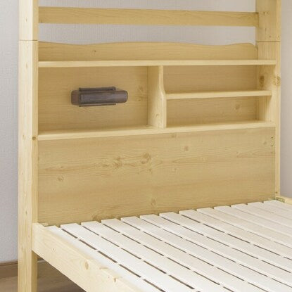 Beautiful pine wood grain. A sturdy bunk bed with shelves and lighting (NA)