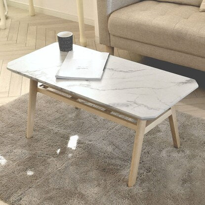 Luxurious marble-look center table with shelf