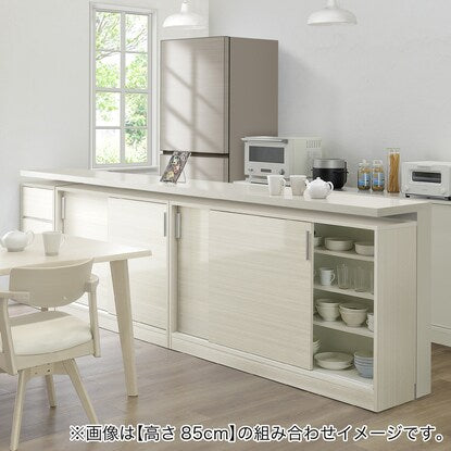 A slim cabinet with a beautiful wood grain pattern and drawers (width 30 x height 85 cm, gloss finish WW)