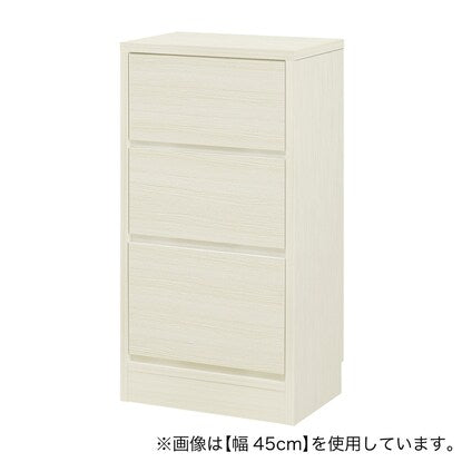 A slim cabinet with a beautiful wood grain pattern and drawers (width 47 x height 85 cm, gloss finish WW)