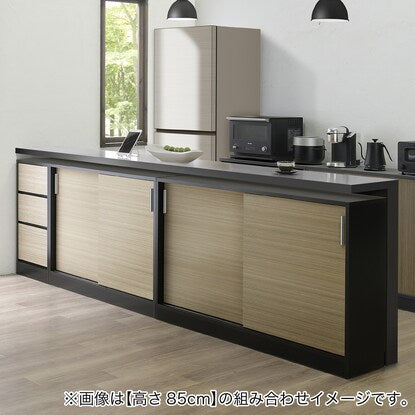 A slim cabinet with beautiful wood grain pattern and sliding doors (width 90 x height 85 cm NGY)