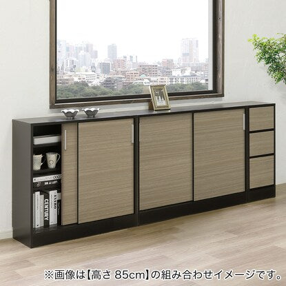 A slim cabinet with beautiful wood grain pattern and sliding doors (width 90 x height 85 cm NGY)