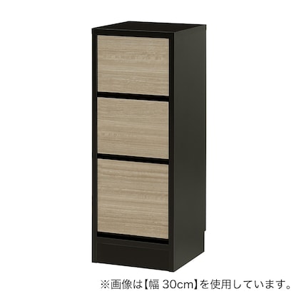 A slim cabinet with a beautiful wood grain pattern and drawers (width 31 x height 85 cm NGY)