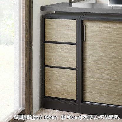 A slim cabinet with a beautiful wood grain pattern and drawers (width 31 x height 85 cm NGY)