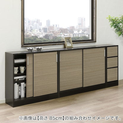 A slim cabinet with a beautiful wood grain pattern and drawers (width 31 x height 85 cm NGY)