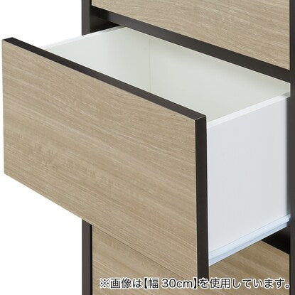 A slim cabinet with a beautiful wood grain pattern and drawers (width 32 x height 85 cm NGY)