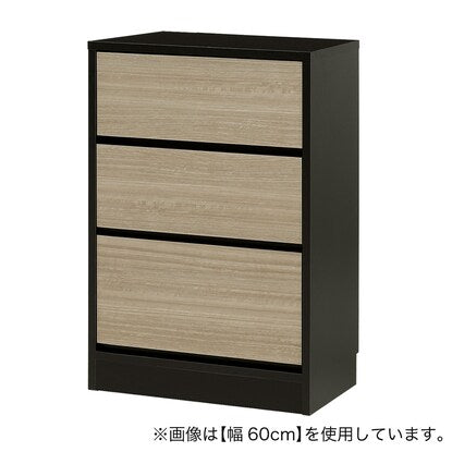 A slim cabinet with a beautiful wood grain pattern and drawers (width 55 x height 85 cm NGY)