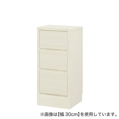 A slim cabinet with a beautiful wood grain pattern and drawers (width 34 x height 70 cm, gloss finish WW)