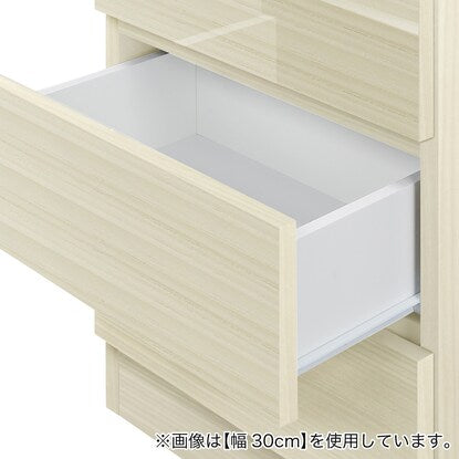 A thin square cabinet with a beautiful wood grain pattern and drawers (width 31cm, gloss finish WW)