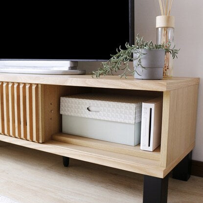 A TV stand featuring natural wood decorations (150cm wide, NA)