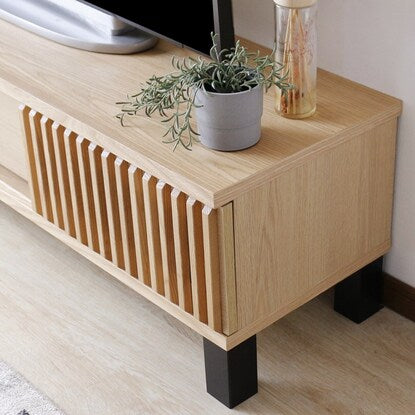 A TV stand featuring natural wood decorations (150cm wide, NA)