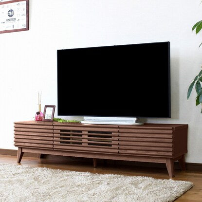 A TV stand (150 WAL) with attractive natural wood decorations