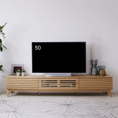 A TV stand (200 NA) with attractive natural wood decorations