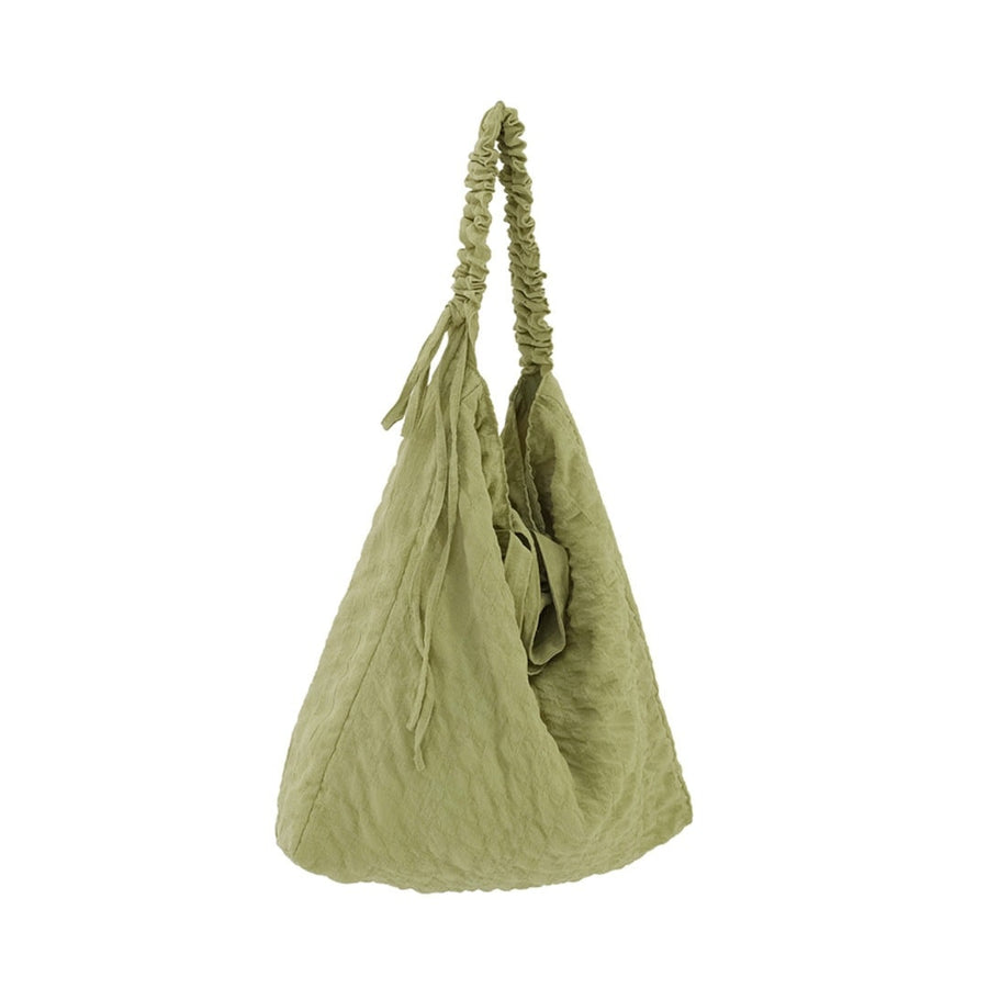 A crumpled drawstring gathered handle bag