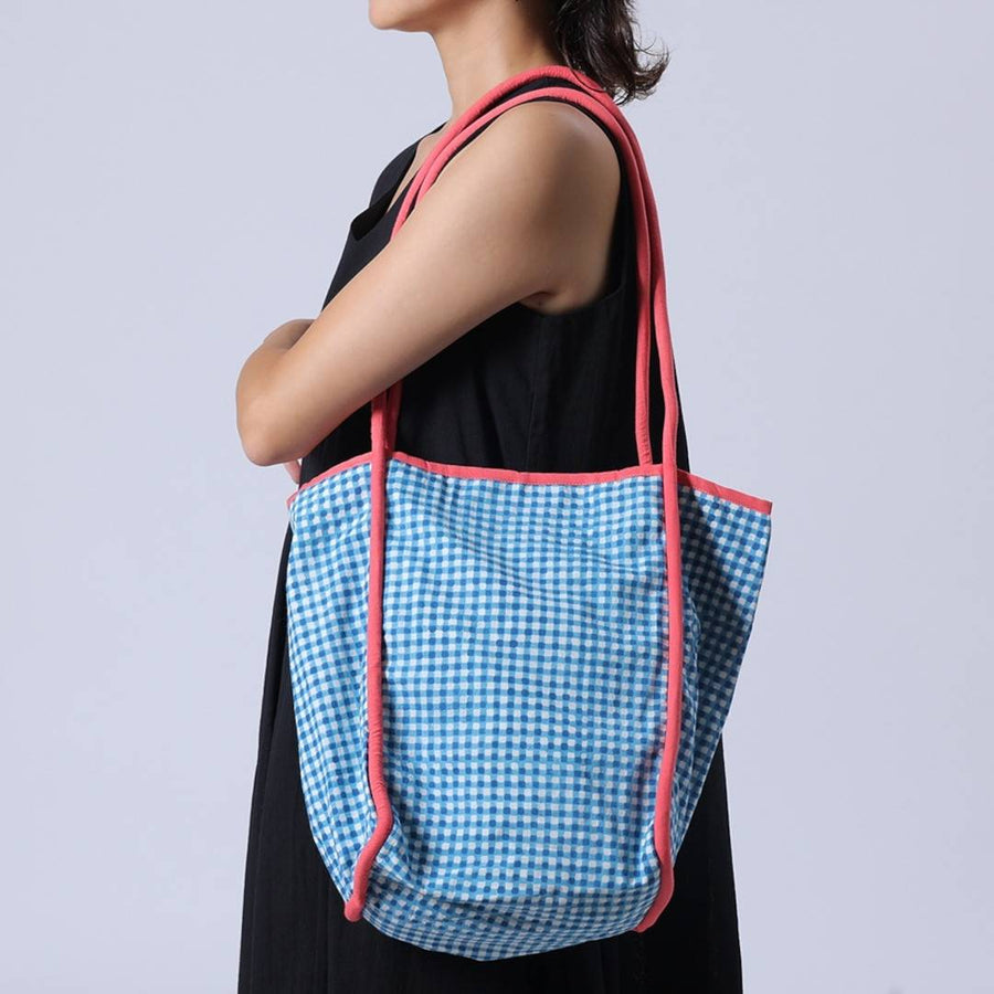 Block-printed gingham check bag with piping accents