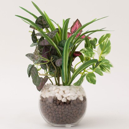 Fake greenery in a glass pot (2 glass pots in a green pot)