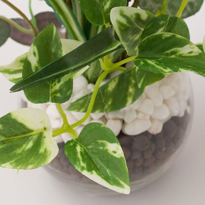 Fake greenery in a glass pot (2 glass pots in a green pot)