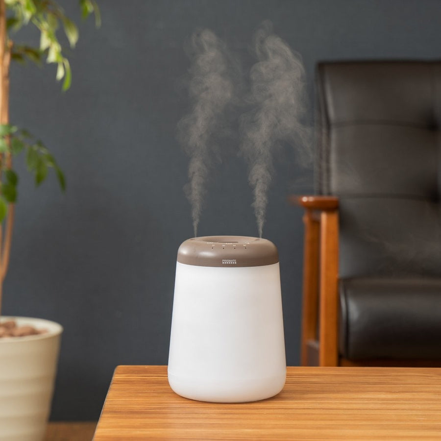 Cordless top-fill humidifier with dual mist function that prevents water from spilling even if it falls over.