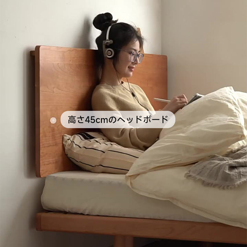 Compact natural wood bed with headboard