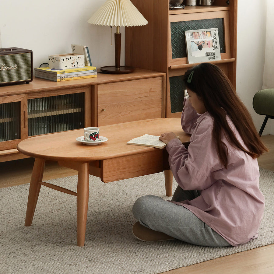 Oval wooden centre table with drawer
