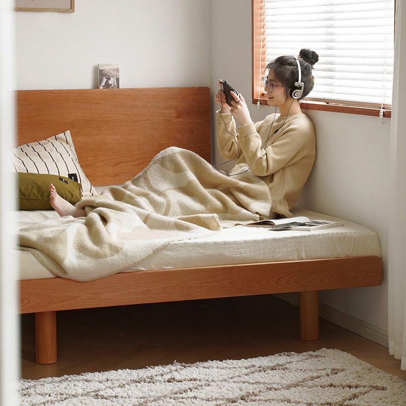 Compact natural wood bed with headboard