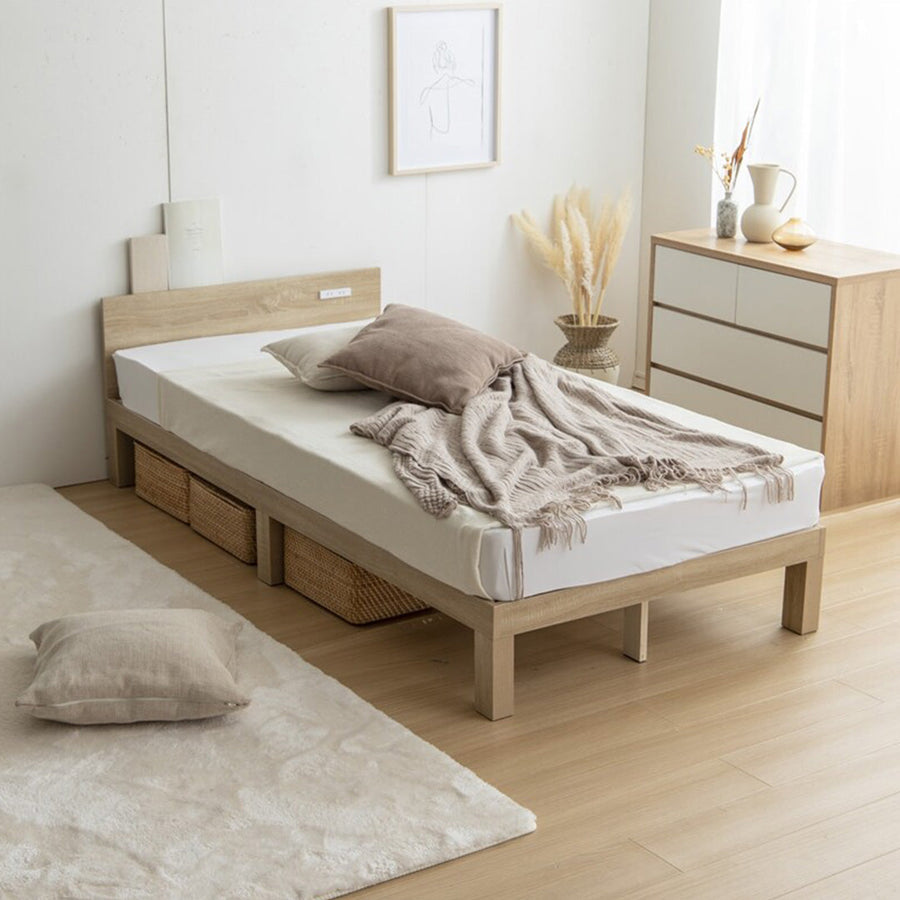 Single bed with outlet and slatted base