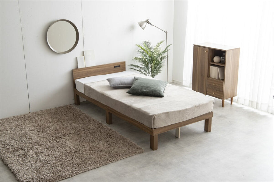 Single bed with outlet and slatted base