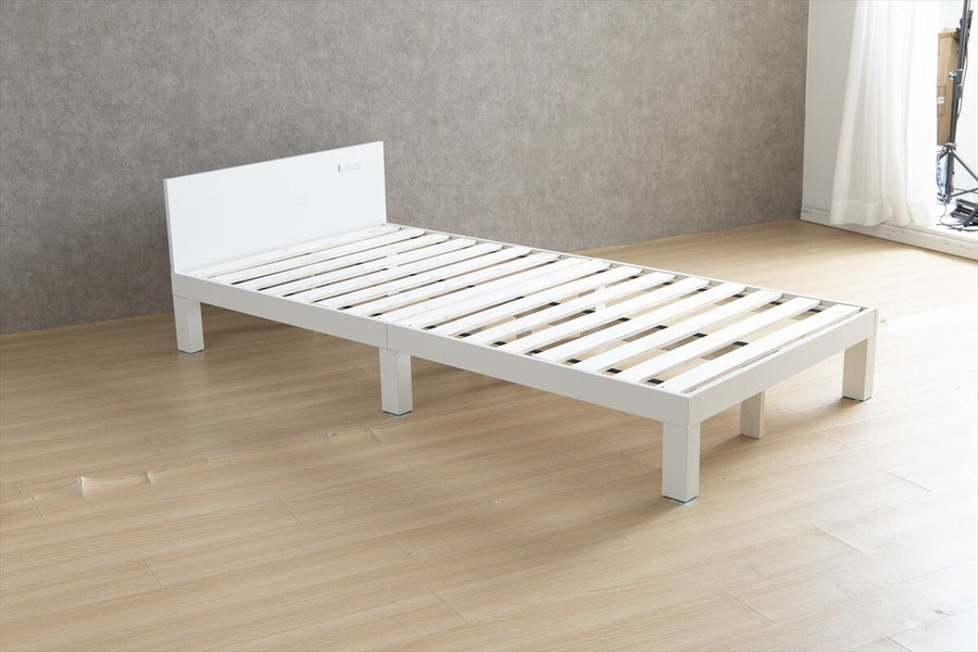 Single bed with outlet and slatted base