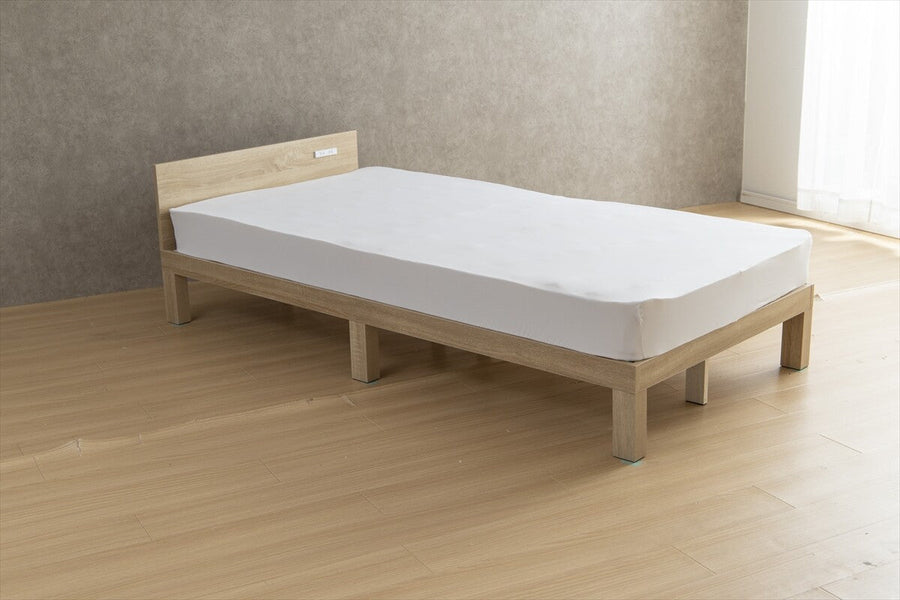 Single bed with outlet and slatted base