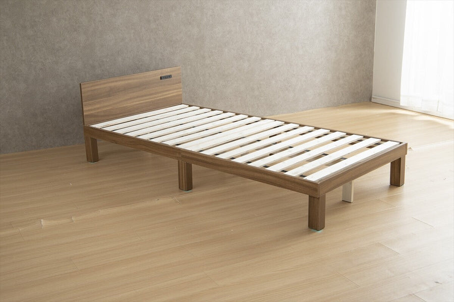 Single bed with outlet and slatted base