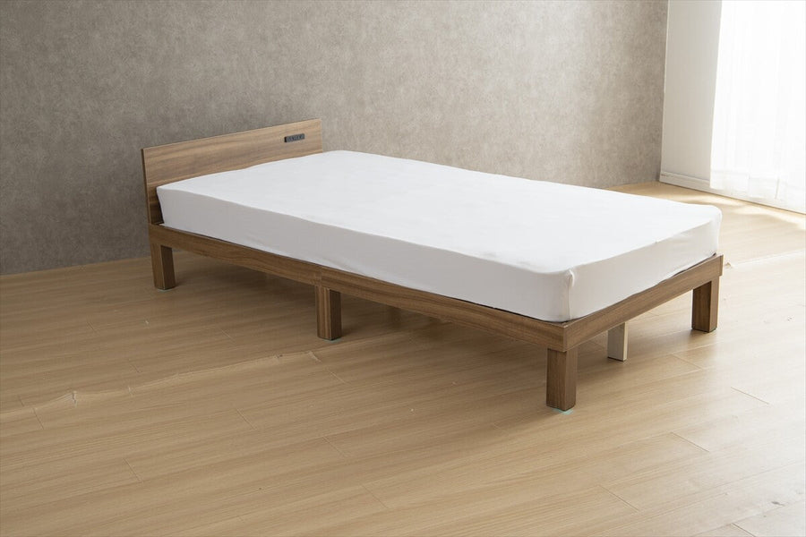 Single bed with outlet and slatted base