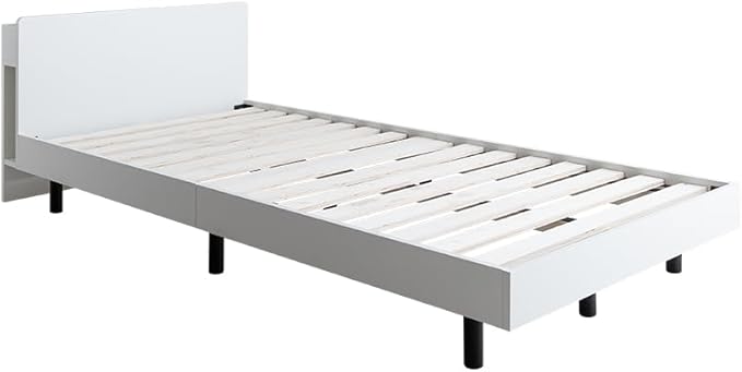 Simple single bed with outlet, headboard and bonnell mattress