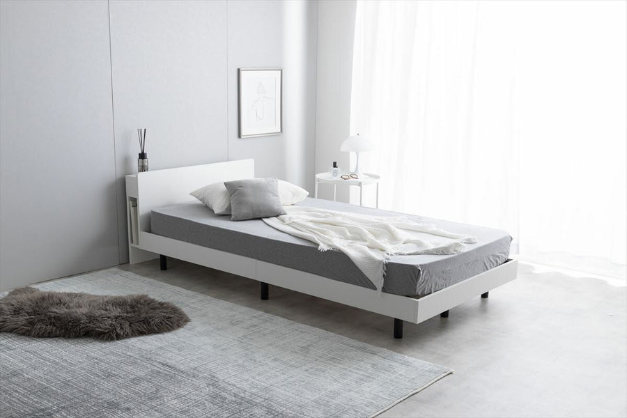 Simple single bed with outlet, headboard and bonnell mattress